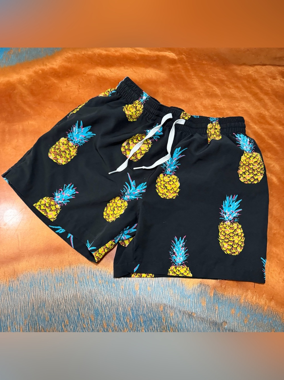 Chubbies 5.5” inseam Black Swim Trunks with Pineapple Print medium mesh lined